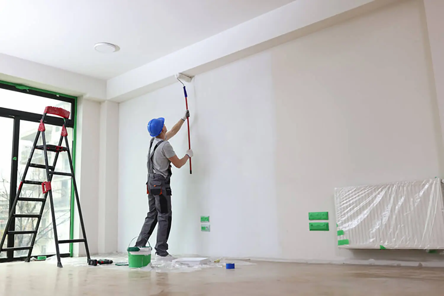 4:27 PMClaude responded: A professional painter rolling primer or paint onto an interior wall during a residential painting project.A professional painter rolling primer or paint onto an interior wall during a residential painting project.