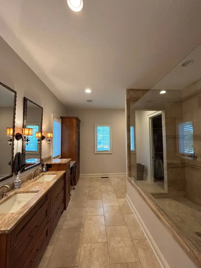 Interior hallway with freshly painted neutral walls and wood flooring in a Brownsburg, IN home