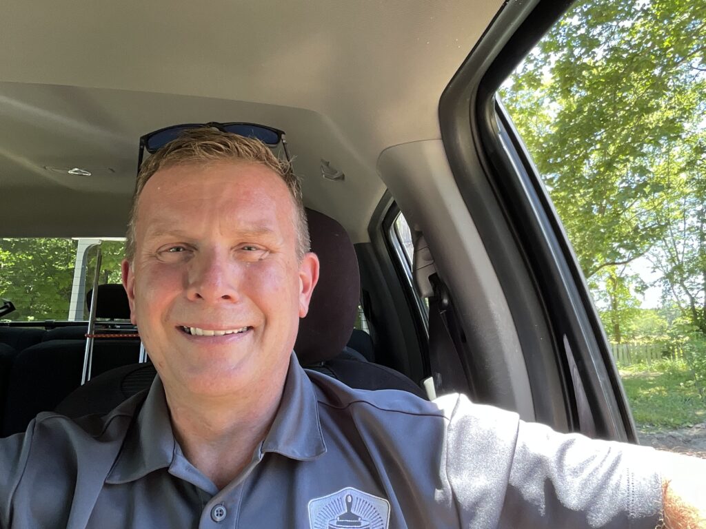 A photo of Brian Kotarski the owner of Integrity in Blue Painting sitting in his truck. Our core values. 